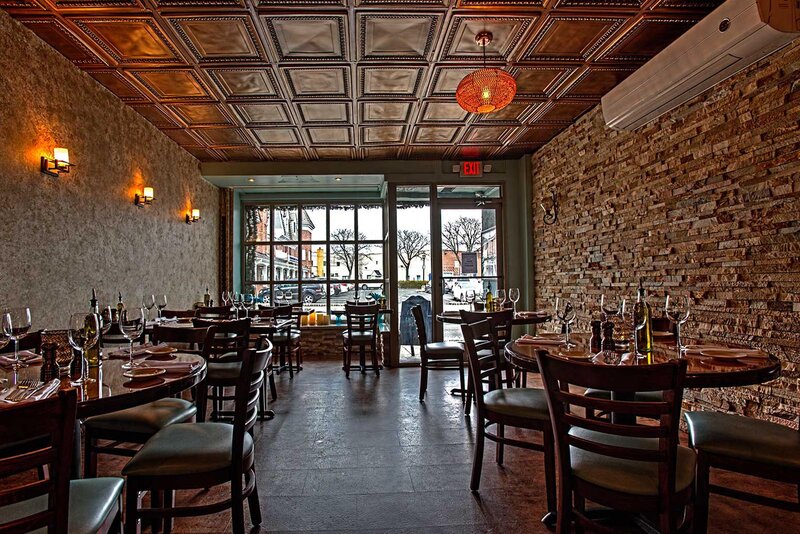 Dining room with set tables and view of the outside