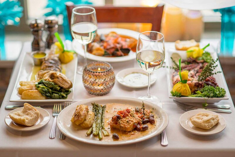 Alaskan cod entree on set table with other dishes