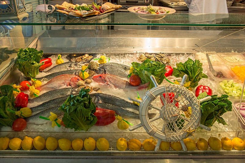 Fresh fish and vegetables in a display case