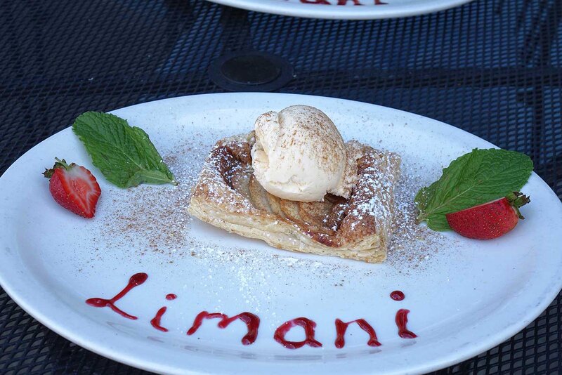 Strudel dessert topped with ice cream with Limani spelt on plate