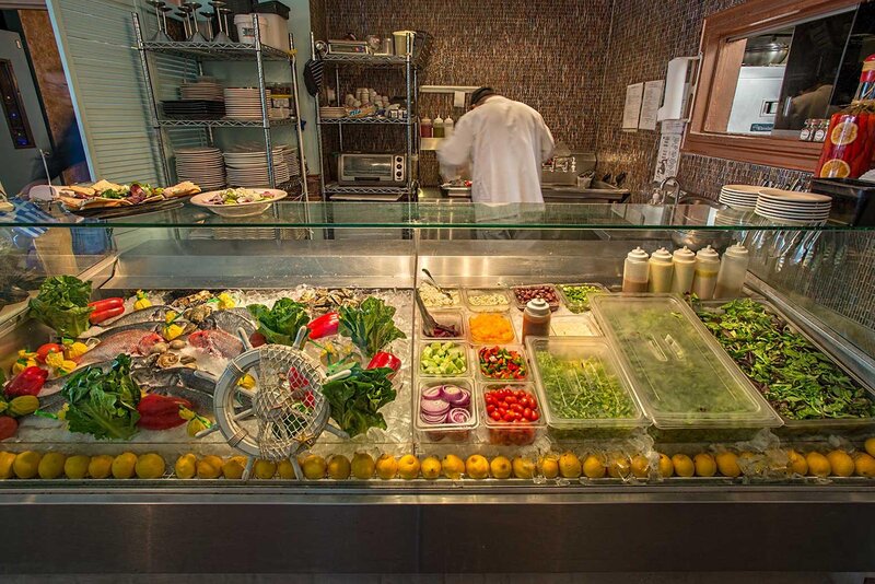 Seafood and salad bar in a display case